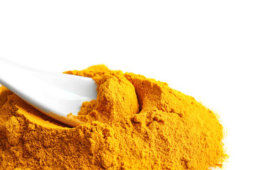 Wall Mural - Heap of turmeric powder with spoon on white background