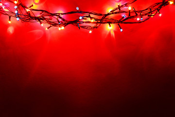 Wall Mural - Christmas lights on color background