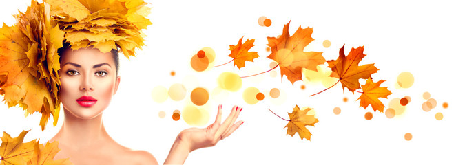 Wall Mural - model girl with autumn bright leaves hairstyle showing empty copy space on open hand palm for text