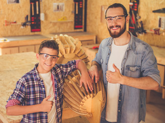 Wall Mural - Father and son working with wood