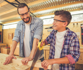 Wall Mural - Father and son working with wood