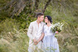 © ronedya - Young couple in love outdoor. Elegant bride and groom posing together outdoors on a wedding day. bride and groom in the Park. young couple in the woods. young couple in the grass. couple walking