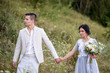 © ronedya - Young couple in love outdoor. Elegant bride and groom posing together outdoors on a wedding day. bride and groom in the Park. young couple in the woods. young couple in the grass. couple walking