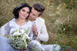 © ronedya - Young couple in love outdoor. Elegant bride and groom posing together outdoors on a wedding day. bride and groom in the Park. young couple in the woods. young couple in the grass. couple walking