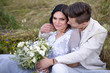 © ronedya - Young couple in love outdoor. Elegant bride and groom posing together outdoors on a wedding day. bride and groom in the Park. young couple in the woods. young couple in the grass. couple walking