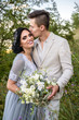 © ronedya - Young couple in love outdoor. Elegant bride and groom posing together outdoors on a wedding day. bride and groom in the Park. young couple in the woods. young couple in the grass. couple walking