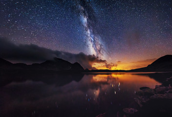 Wall Mural - milky way on over the mountain lake