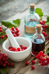 Wall Mural - Bottle of Guelder rose (Red Viburnum) tincture and mortar 