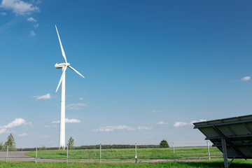 Energy windmill produce energy on blue sky at daytime