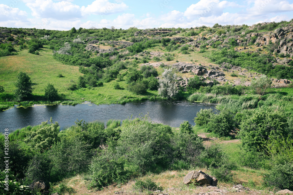 Green hills under blue sky