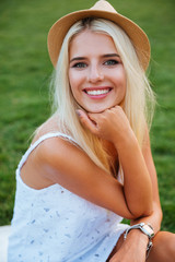 Sticker - Close up portrait of a smiling young woman in hat