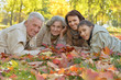 © aletia2011 - Happy family relaxing in autumn forest