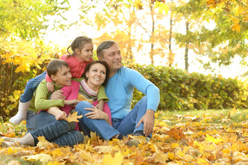 Wall Mural - Happy family in autumn park