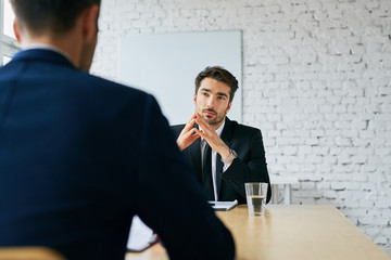 Wall Mural - Job interview - two businessmen talking