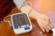 Woman is taking care for health with blood pressure