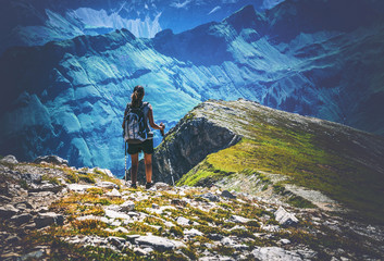 Wall Mural - hiker looking across valley in the alps