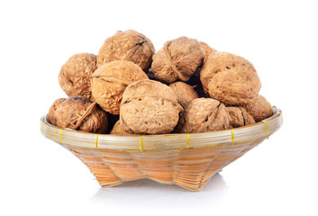 Wall Mural - walnut in basket on white background