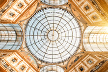 Interior With Beautiful Glass Vaults In The Famous Vittorio Emanuele Shopping Gallery In The Center Of Milan City.
