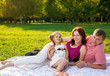 © 7stock - Happy young family having picnic at meadow