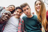 Fototapeta  - Multiracial group of friends taking selfie