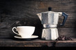© reshoot - still life photography : old espresso maker with coffee beans and white coffee cup on old wooden shelf