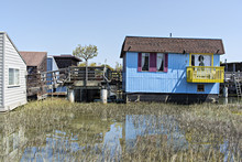 Blue Houseboat With Yellow Deck