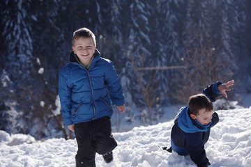 kids playing with  fresh snow