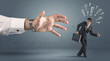 © ra2 studio - Business person getting away from a big hand