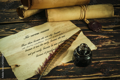 Photographie Roll of parchment with a pen and inkwell