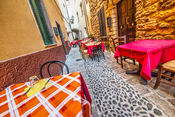 Wall Mural - rustic tables in Castelsardo old town