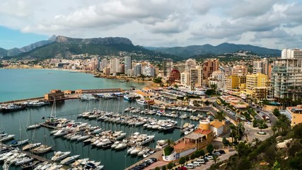 Sticker - Aerial view of Calpe, Costa Blanca during the day. Popular summer resort in Spain with mediterranean sea and Las Salinas lake, mountains at the background, skyscrapers - hotels, apartments. Time-lapse