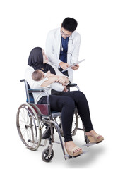 Wall Mural - Doctor talks with disabled mother