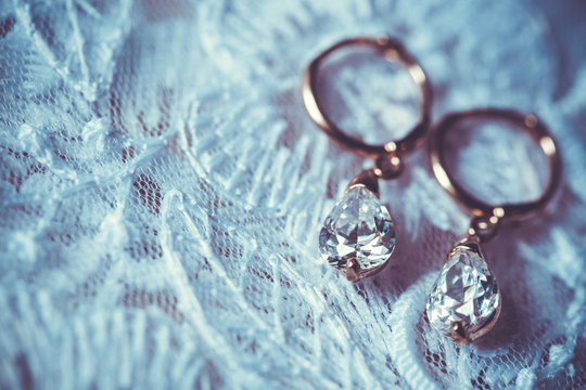 earrings on the white wedding dress