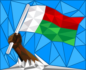  Strong Hand Raising The National Flag Of Madagascar