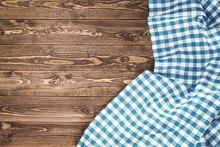 Blue Checkered Tablecloth On Wooden Table