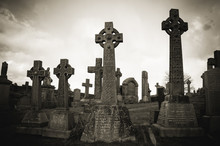 Old Stone Celtic Crosses On A Graveyard