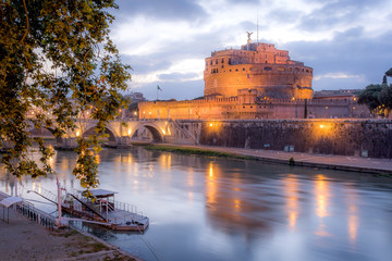 Castel Sant'Angelo, in Rome, Italy, on a cloudy evening, with river Tiber