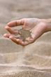 © rodimovpavel - sand running through hand