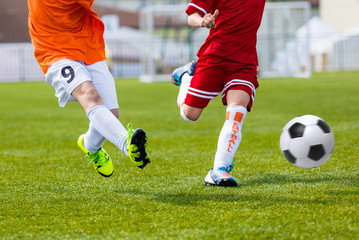 Children kicking football soccer match. Football match for young boys. Training and football soccer tournament