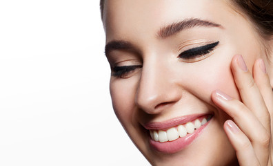 smiling girl with clean skin with natural make-up and with the arrow on the eyes close up