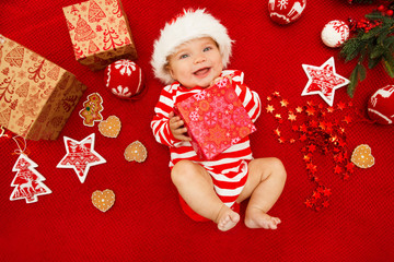 baby first christmas. beautiful little baby celebrates christmas. new year's holidays. baby with san