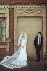 beautiful gorgeous happy blonde bride and groom on the backgroun