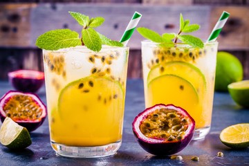 Wall Mural - tropical cocktail with passion fruit, lime and mint