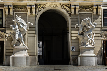 hercules statue near entrance of hofburg palace. vienna, austria