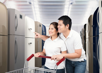 Canvas Print - asian couple shopping refrigerator