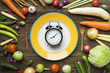 Food clock. Healthy food concept on wooden table