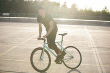 Young Man Riding Bike