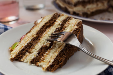 A close up of a piece of a sweet cake with a fork