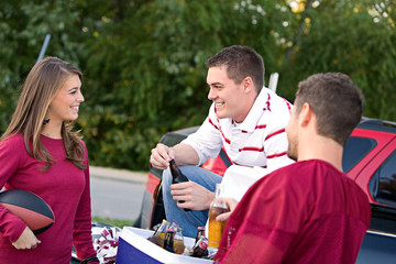 Wall Mural - Tailgating: Friends Having Drinks And Talking About Game