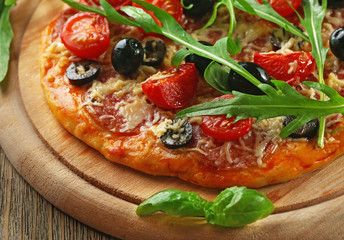 Sticker - Tasty pizza with vegetables, herbs on wooden background